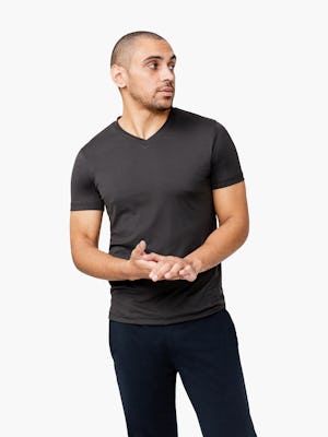 Men's Black Responsive V-Neck Tee model facing forward with hands clasped
