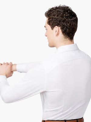 Men’s White Brushed Apollo Dress Shirt model facing backward with arms stretched and hands clasped to the left