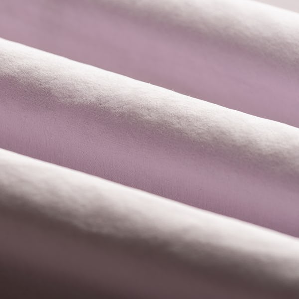Close-up of Light Pink Fabric Rolls