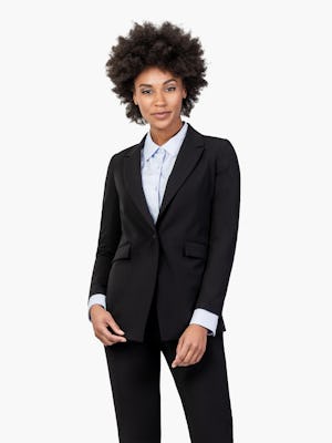 Women's Black Velocity Blazer on Model Leaning Forward and to the Right