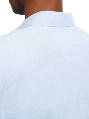 Close up of Men's Solid Blue Oxford Nylon Aero Dress Shirt on Model facing backward