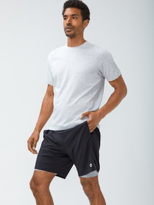 Men's Light Grey Composite Merino Active Tee and Men's Navy Newton Active Shorts on Model with hand in pocket