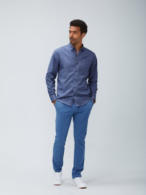 Men's indigo heather gingham aero button down and storm blue momentum chino model facing forward with hands in pockets