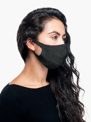 side shot of model wearing dark grey 3d print knit mask 2.0