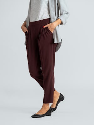 women's deep ruby swift drape pant close up of model with hands in pockets
