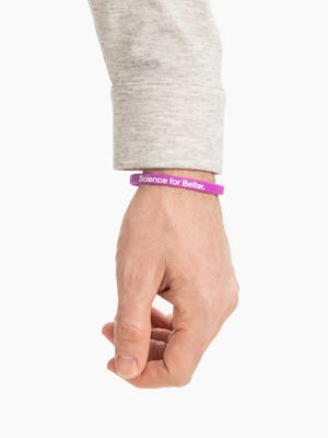 purple science for better vaccine awareness bracelet on wrist showing the science for better side