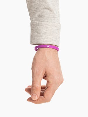 purple science for better vaccine awareness bracelet on wrist showing the M° logo