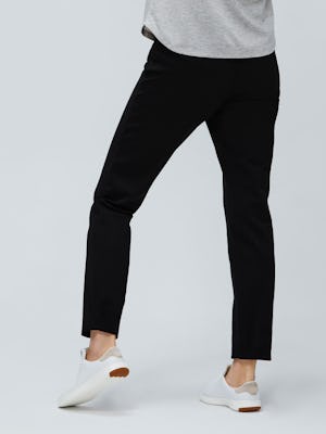 women's black fusion straight leg pant zoomed image of model facing away in sneakers