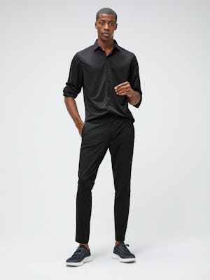 Men's Black Recycled Apollo Shirt and Men's Black Kinetic Tapered Pant on Model facing forward