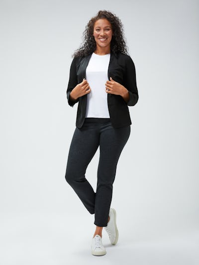 women's black kinetic blazer and white luxe touch tank and grey heather houndstooth fusion straight leg pant model facing forward with hands on lapels