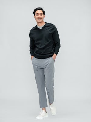 Men's Charcoal Static Atlas V-Neck Sweater and Men's Light Grey Momentum Chino on model walking forward
