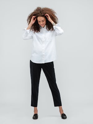 Women's White Aero Zero Oversized Shirt with Black Swift Drape Pant on model playing with hair