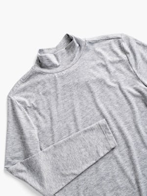 women's pale grey heather composite merino mock neck close up of front with sleeve folded over