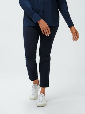 women's navy juno blouse and navy fusion straight leg pant model stepping forward