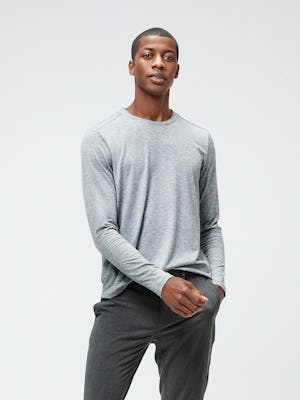 Men's Charcoal Grey Heather Composite Merino Long Sleeve Tee and Men's Graphite Velocity Tapered Pant on model facing forward