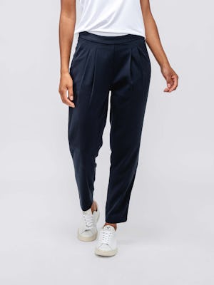 model wearing womens swift drape pant navy and womens luxe touch tee white bottom half walking