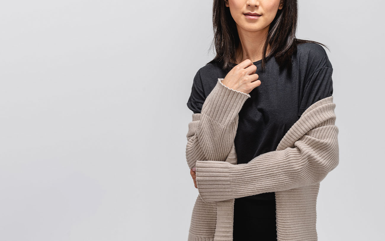 close up of model wearing composite merino boxy tee and cardigan