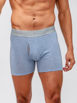 model wearing men's light blue heather composite merino boxer brief close up of front