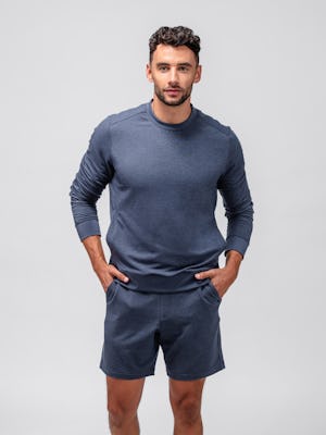 model wearing men fusion terry sweatshirt navy and men fusion terry short navy both hands in pocket standing