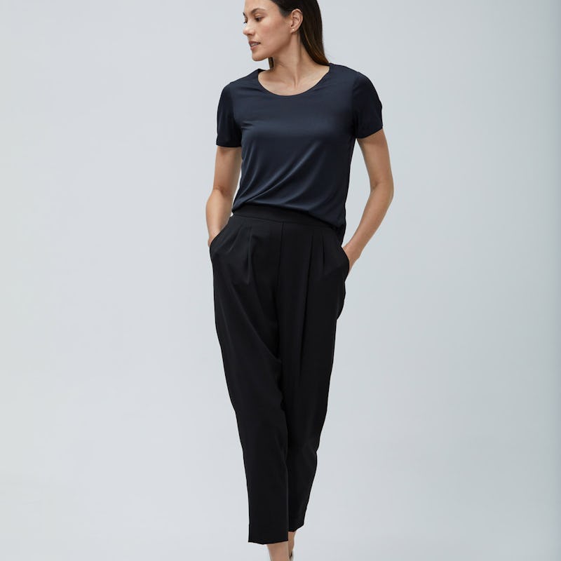 women's black luxe touch tee and women's black swift drape pant model facing forward hands in pockets