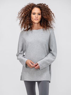 women's light grey 3d print knit slouchy sweater and charcoal heather joule active legging model facing forward with hands clasped