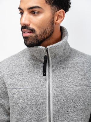 model wearing grey heather composite merino ecofleece close up of zipped collar