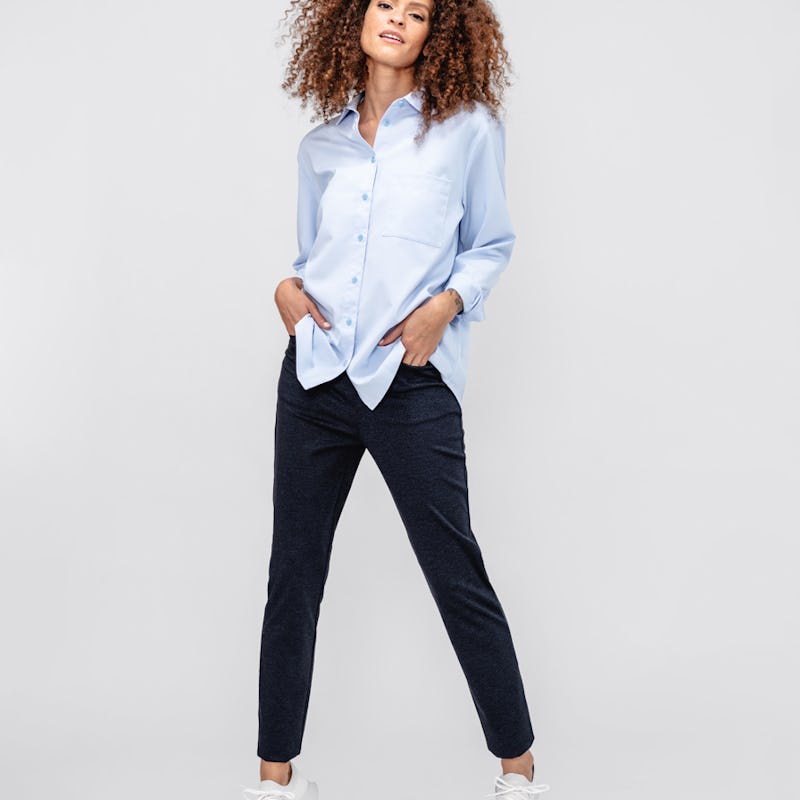 model wearing women's navy herringbone fusion straight leg pant and chambray blue aero zero oversized shirt facing forward with hands in pockets