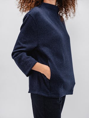 model women's indigo heather hybrid mock neck sweater and navy herringbone fusion straight leg pant with hands in pockets