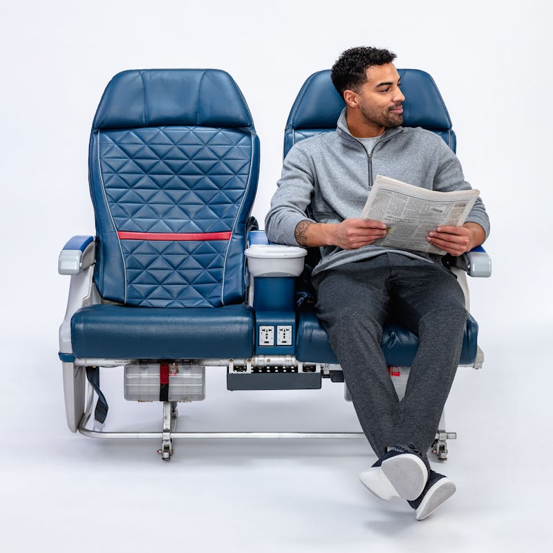 Man sitting on airplane seat