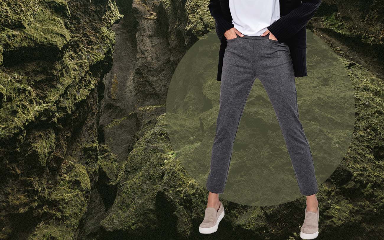 model wearing women's fusion straight leg pant standing in front of a mossy background