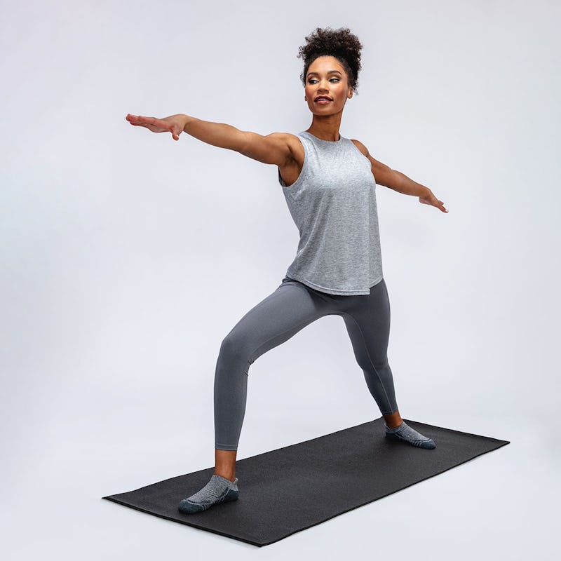 model doing yoga wearing joule active legging, composite merino active tank and atlas ankle socks