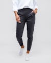 Women's Charcoal Kinetic Pull on Pant on model walking forward with hand in pocket