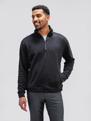 Men's Black Tweed Hybrid Fleece 1/4 Zip Pullover on model with hand in pocket