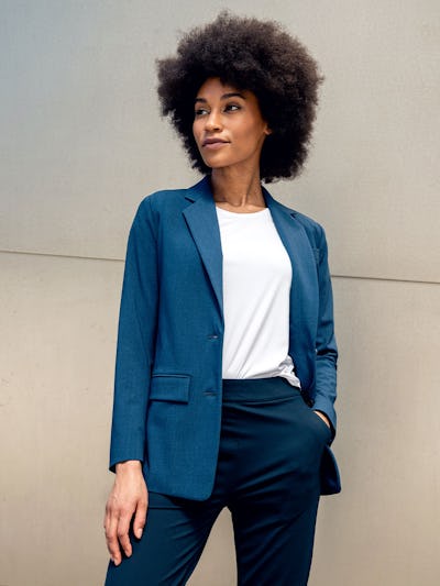 model wearing indigo heather velocity relaxed blazer facing forward with hand in pocket