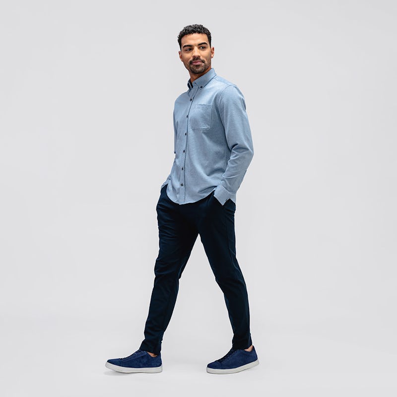 Men's Navy Kinetic Jogger and Chambray Stripe Hybrid Button Down on model walking with hands in pockets