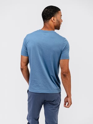 model back wearing men's composite merino tee stone blue and mens kinetic jogger slate blue
