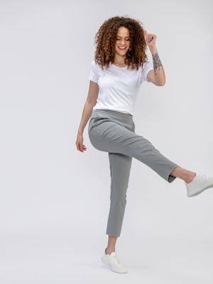 model wearing light grey swift drape pants and composite merino boxy tee white