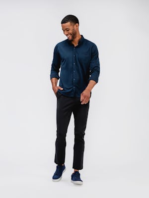 mens dark navy pace tapered chinos and mens apollo raglan sport shirt navy on model standing looking sideways