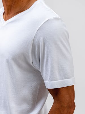 model wearing mens atlas v neck tee white zoom in sleeve shot