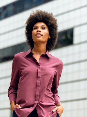 women's deep garnet juno blouse close up of model facing forward hands in pockets