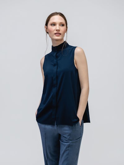 Navy Juno Mock Neck Tank on model with hands in pockets