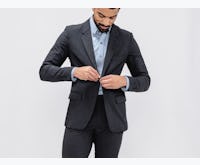 Men's Dark Charcoal Velocity Suit Jacket on model adjusting button