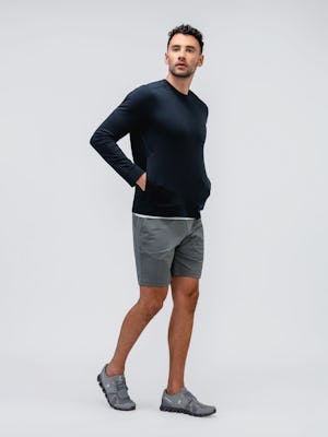 model wearing men's black heather fusion terry sweatshirt and slate grey kinetic pull on short facing forward with hands in pockets