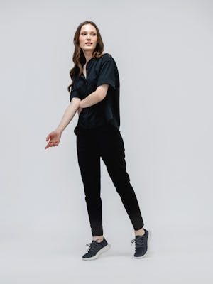 model wearing women fusion terry joggers black and juno boxy blouse black standing on toes