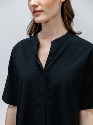 model wearing women juno boxy blouse black upper body shot zoomed in detail