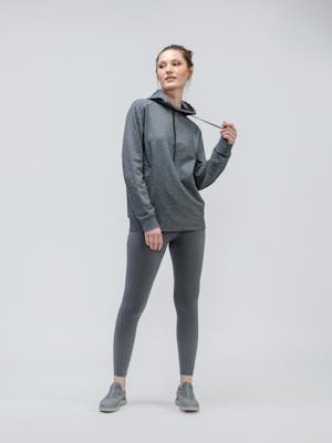 female model wearing classic grey heather fusion terry for all hoodie and charcoal heather joule active legging facing forward