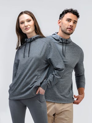 male and female models wearing classic grey heather fusion terry for all hoodie facing forward
