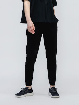 model wearing Women's black fusion terry jogger and black juno boxy blouse facing forward with hand in pocket
