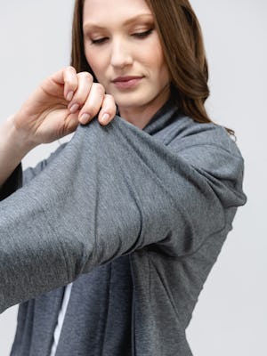 model wearing women's classic grey heather fusion terry cardigan and white luxe touch tee stretching cardigan sleeve