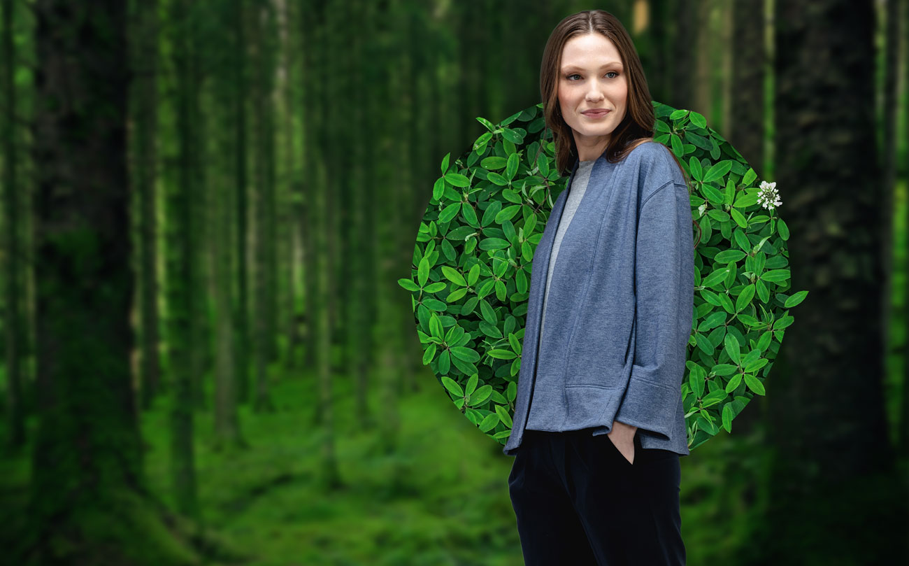model wearing women's fusion terry cardigan in a forest